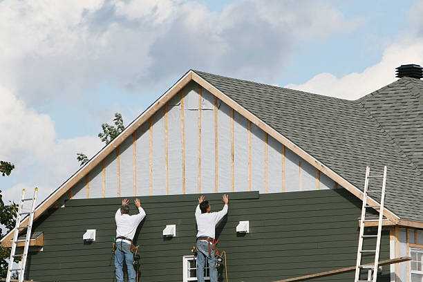 Professional Siding technician working in Dupont, PA